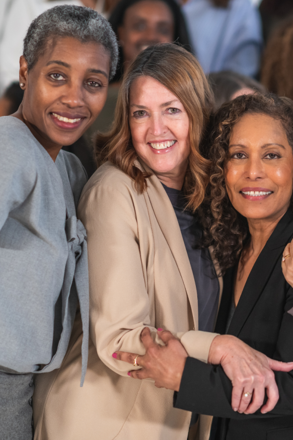 group of women smiling and together
