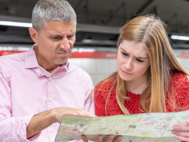 Confused and Lost people looking at a map