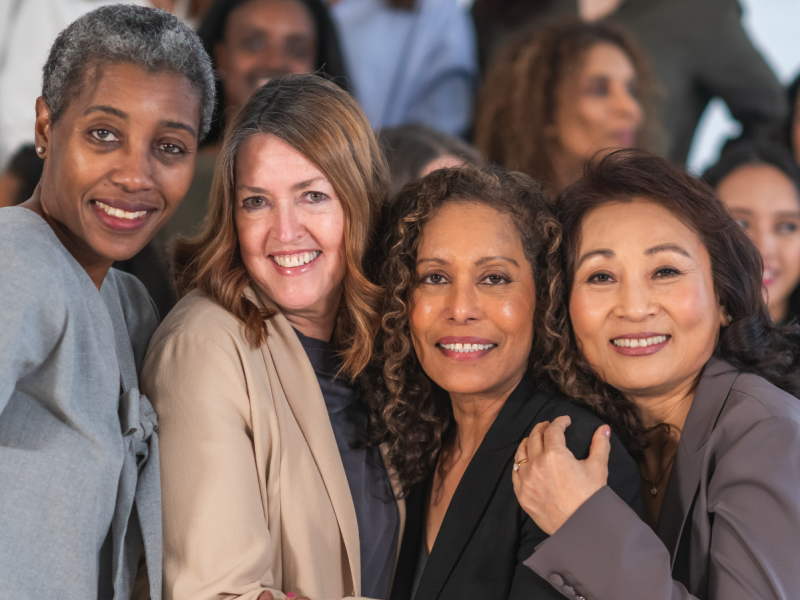 group of women smiling together